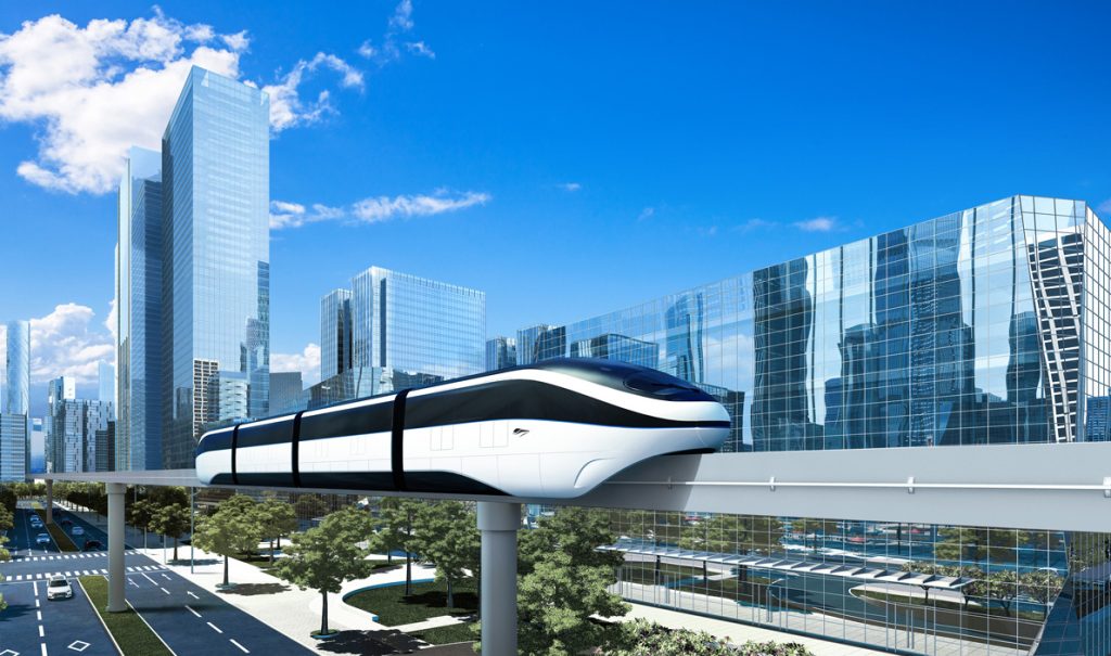 SkyRail on track with buildings in the background